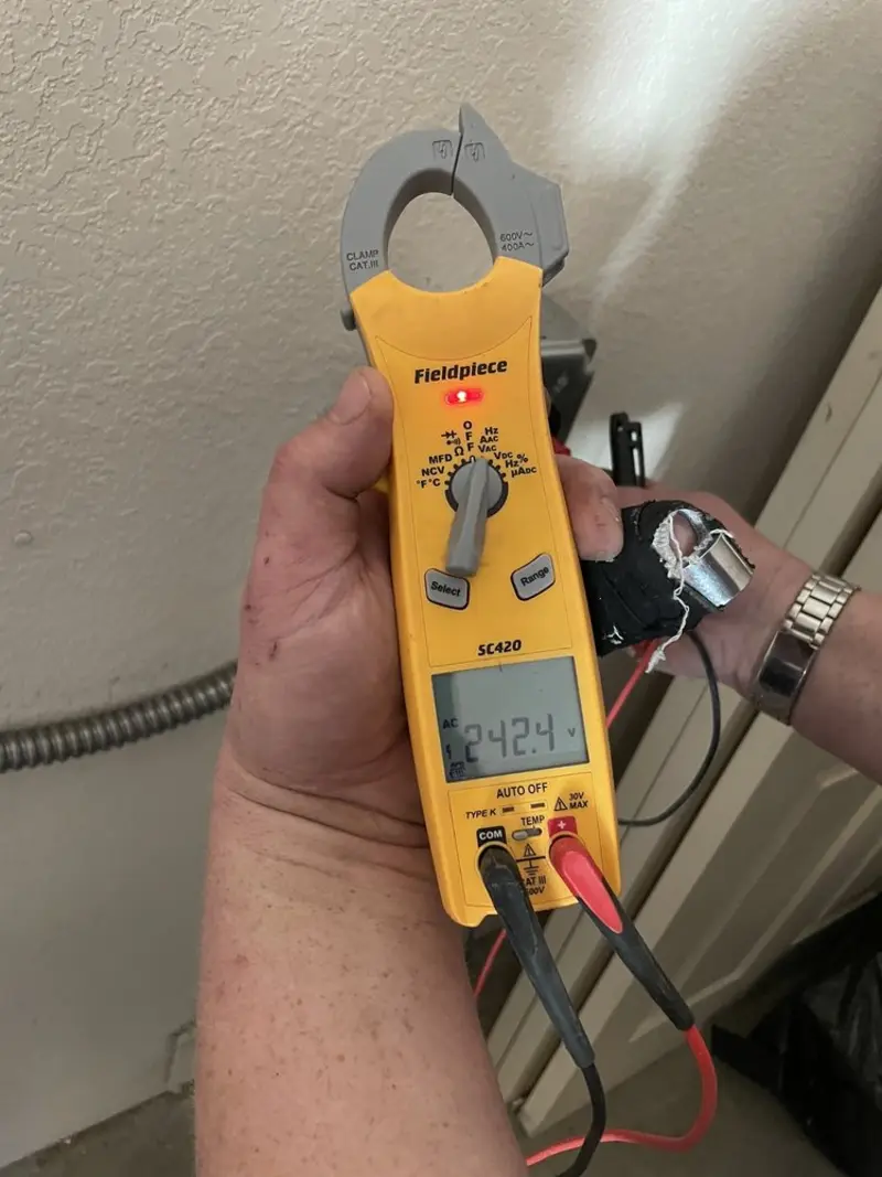 Voltage testing with clamp meter during Recessed Lighting Installation in Perham